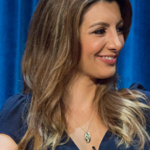 Nasim Pedrad on a panel on stage