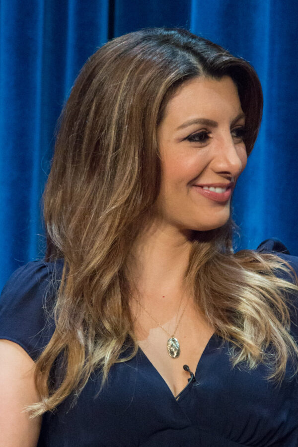 Nasim Pedrad on a panel on stage